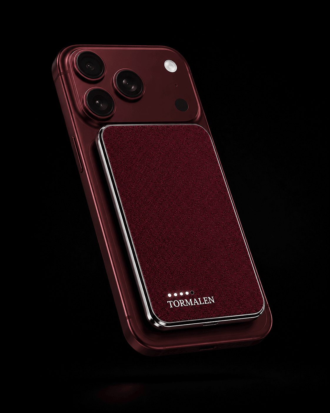 TORMALEN burgundy power bank magnetically attached to a matching red iPhone